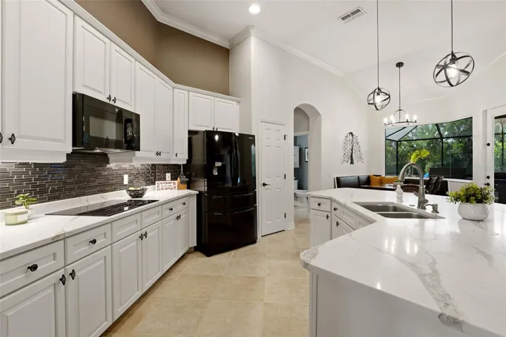 Stunning kitchen with massive curved center island.