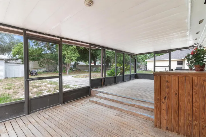 Room for everybody on this Screened Wooden Deck...
