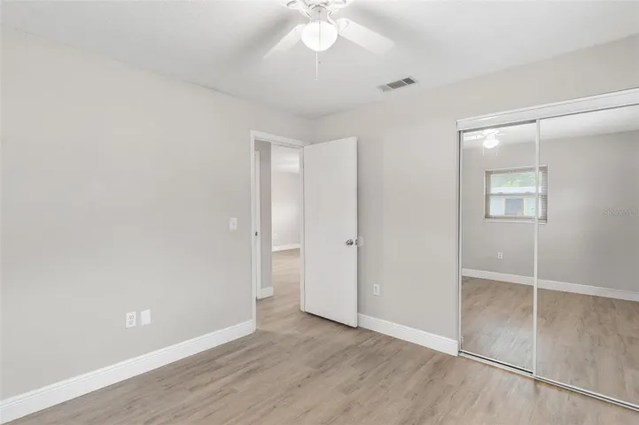 Bedroom 2 with Decorative Mirrored Closet Door