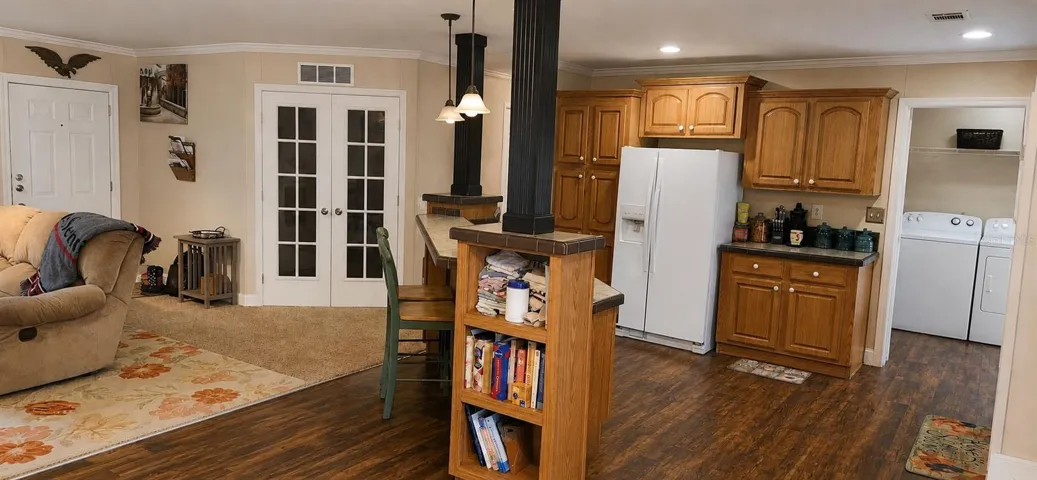 Spacious country kitchen with abundant cabinetry and open-concept design.