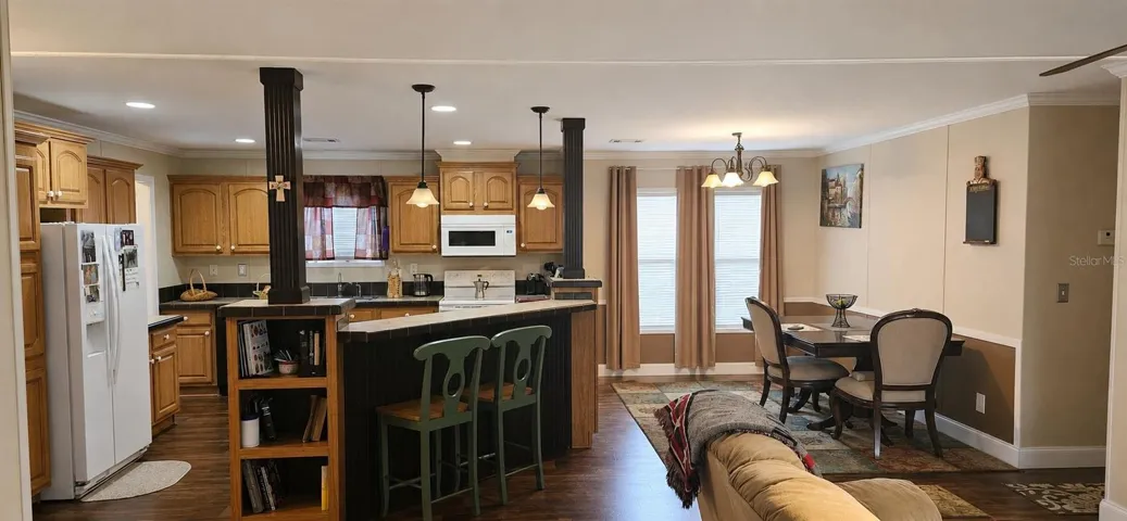COUNTRY KITCHEN opens seamlessly to dining and living areas for entertaining.