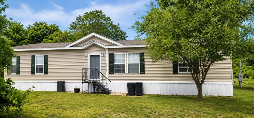 COUNTRY-STYLE HOME nestled within 15+ acres of peaceful Florida countryside.