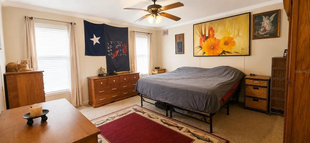 Spacious primary bedroom offering comfort, privacy, and natural light.