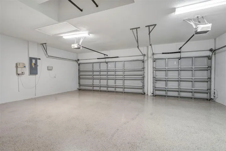 Large 3 car garage with fresh epoxy floors