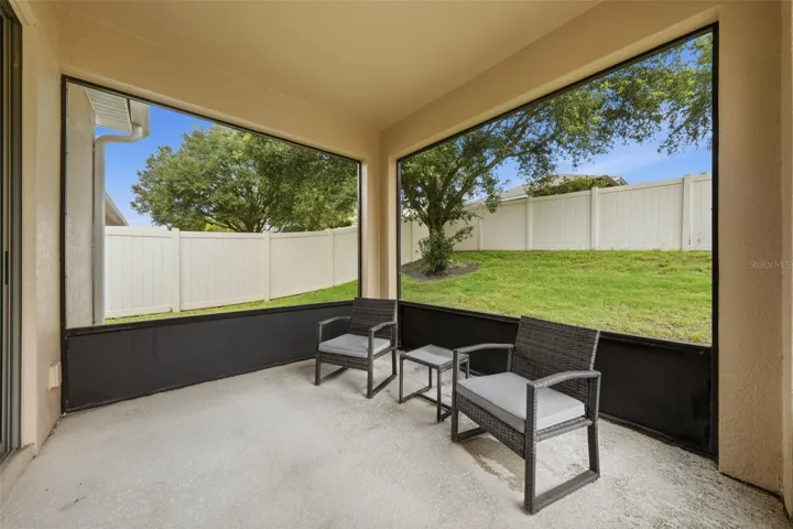 Screened rear porch off the living room.
