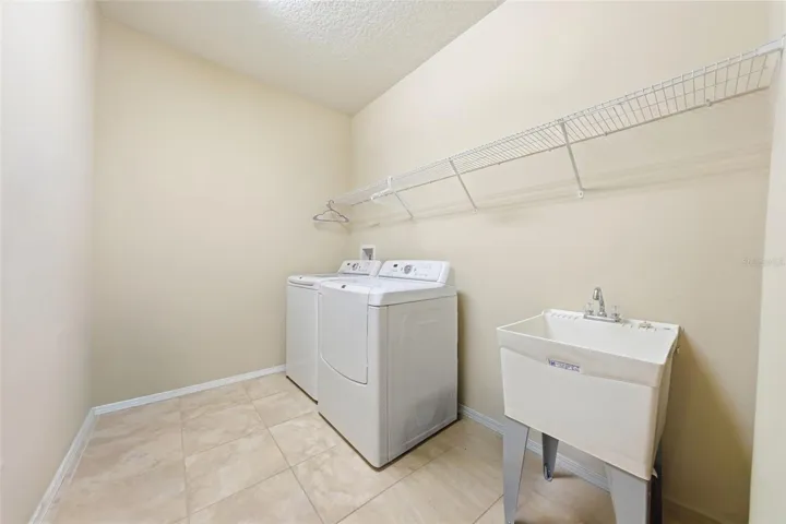 Interior laundry has utility sink.