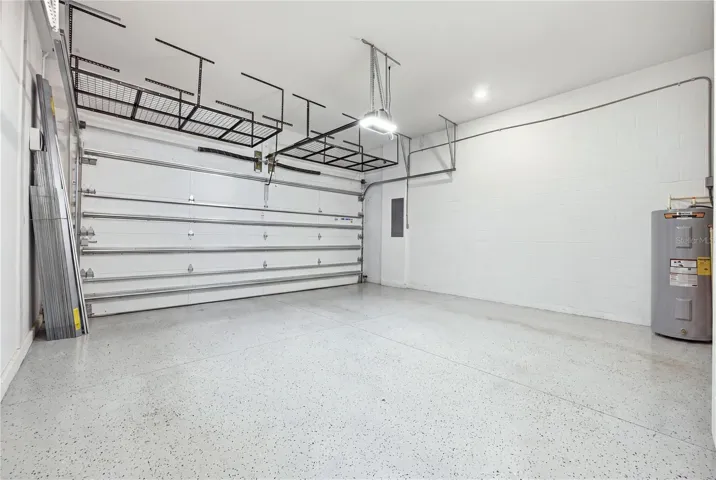 Oversized garage with high ceilings and overhead storage