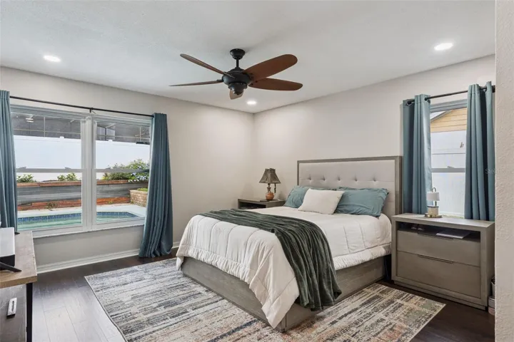 Primary Bedroom with pool views