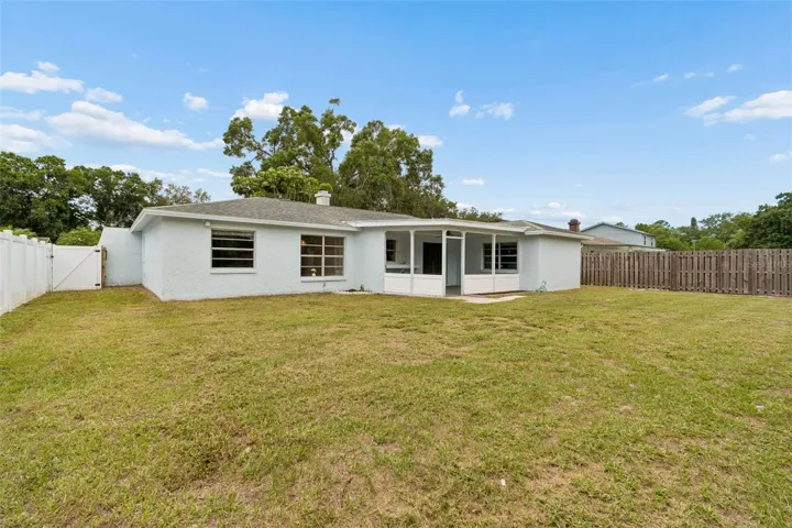 You home offers a beautiful large fenced backyard with a pond view.