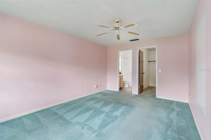 Primary bedroom with extra large walk in closet and ensuite bathroom.