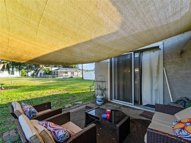CoveredPatio_1018RedBayTer_PortCharlotte_OutdoorLiving_LanaiView.jpg