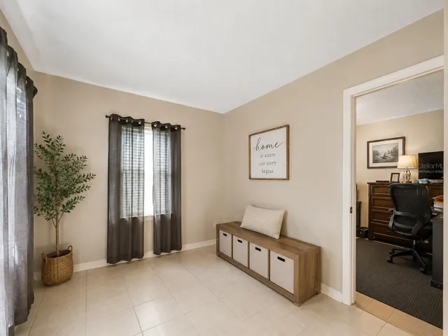 Virtually StagedFlexRoom_1018RedBayTer_PortCharlotte_NaturalLight_Entry.jpg