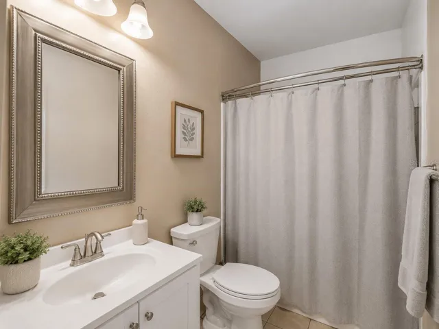 Virtually StagedPrimaryBath_1018RedBayTer_PortCharlotte_CleanFinish_Corner.jpg