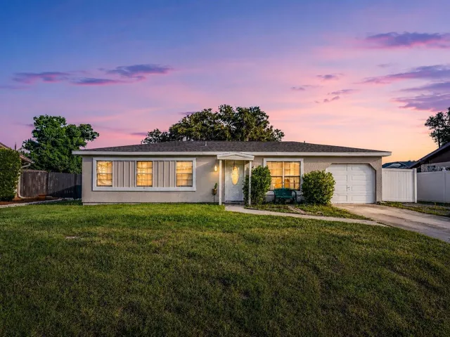 FrontExterior_1018RedBayTer_PortCharlotte_Twilight.jpg