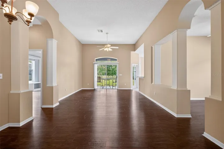 View of Living Room and Dining Room as seen from Entrance Foyer! Your Family Will LOVE Living in the Centrally-Located SECURITY GATED Community of Ekana Green that includes no Though-Traffic and Tennis Courts… as well as the A-Rated OVIEDO SCHOOL DISTRICT!