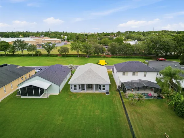 Your Covered Lanai that Overlooks Your Sprawling Green LAWN that goes on without end...Behind you in this Picture are the LAKE...and the GOLF COURSE!