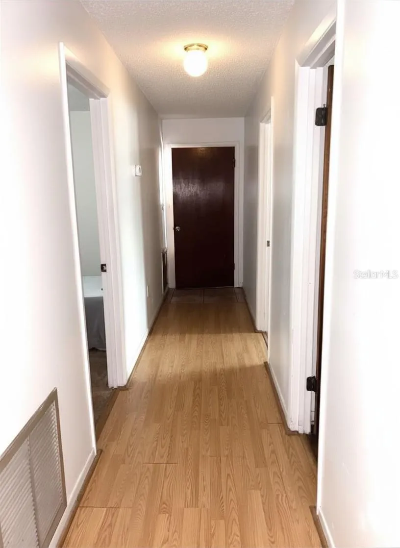 Hall to bedrooms and garage