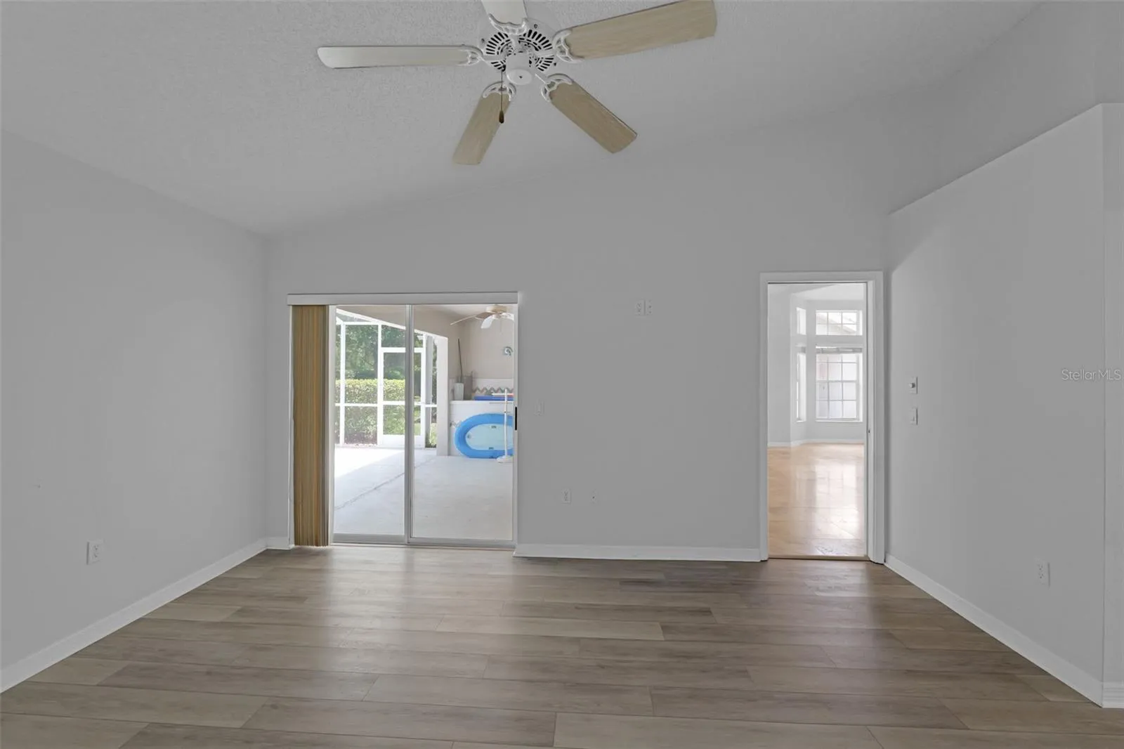 Main bedroom w/sliders to the pool