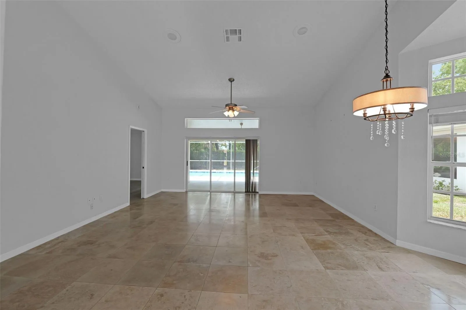 Dining & living room combo. Sliders open all the way for a great breeze and open feel.