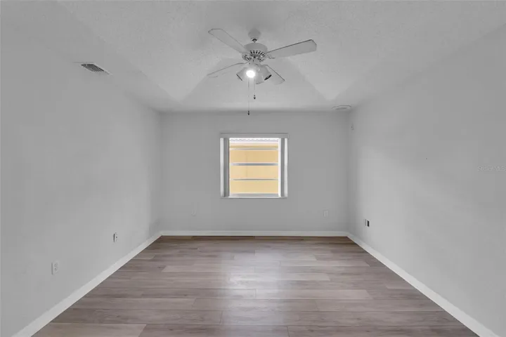 Bedroom 2 with window, door and closet