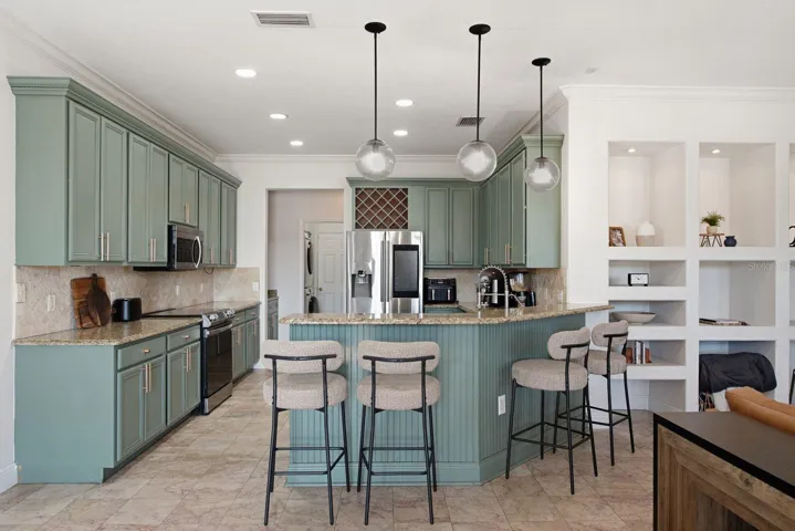Kitchen with fluted wood detail on back of bar/counter