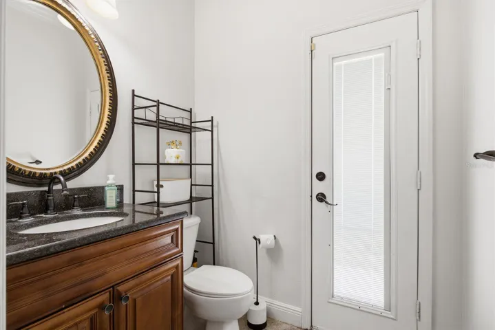 bathroom with exterior exit to pool area/ or walk way to front