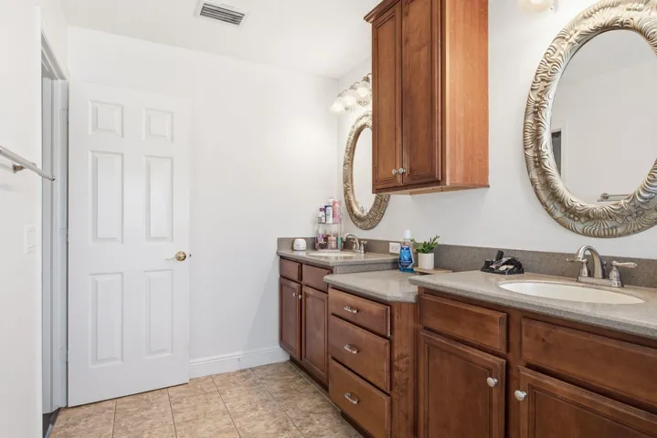 Primary Suite Bathroom vanity with double sinks and vanity extension