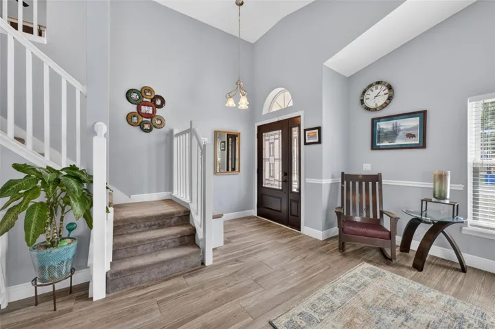 Enter the Great room with vaulted ceilings