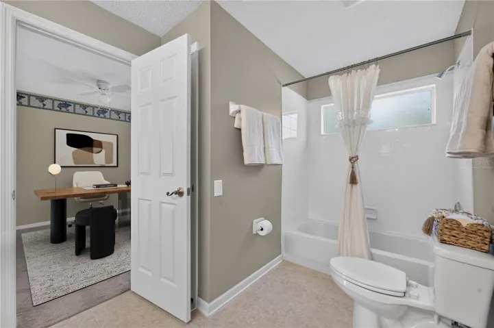 ack and Jill bathroom with virtually staged bedroom 2