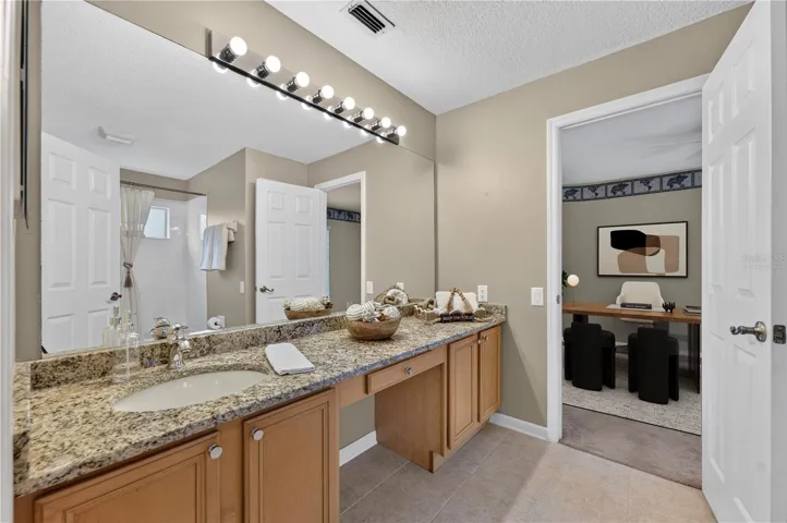 ack and Jill bathroom with virtually staged bedroom 2