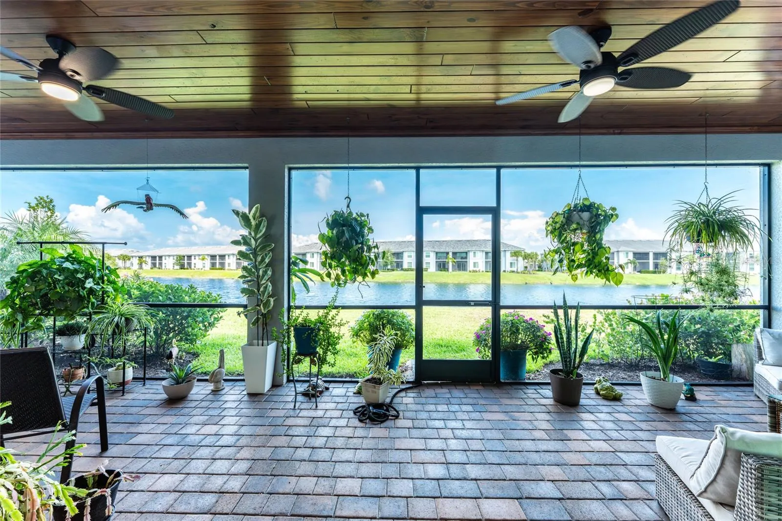 Upgraded ceiling and fans makes this peaceful lanai elegant