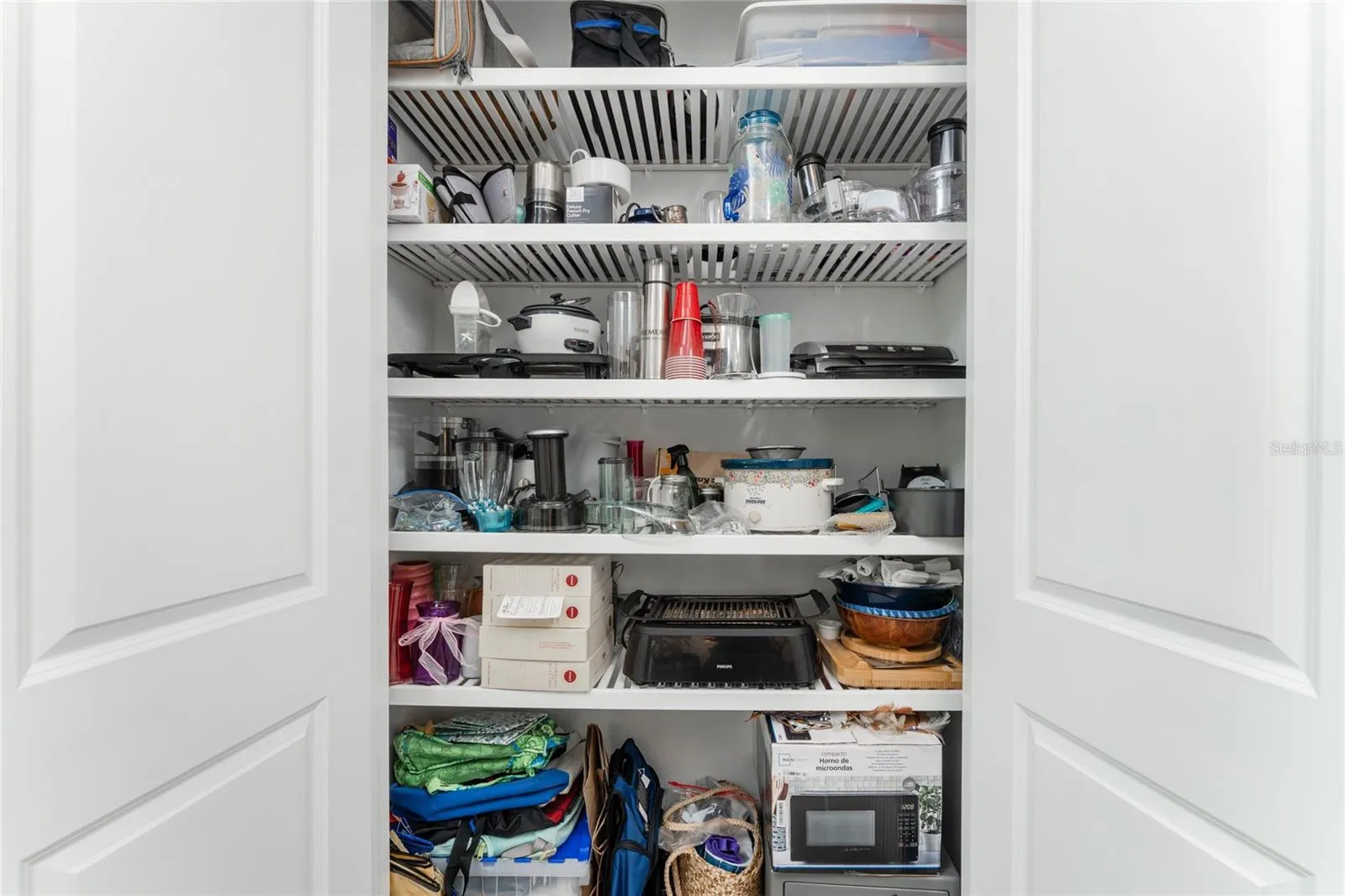Hallway closet with custom shelving