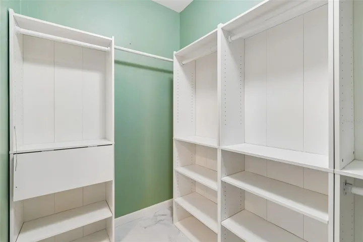 Walk In Closet with Built In Shelves