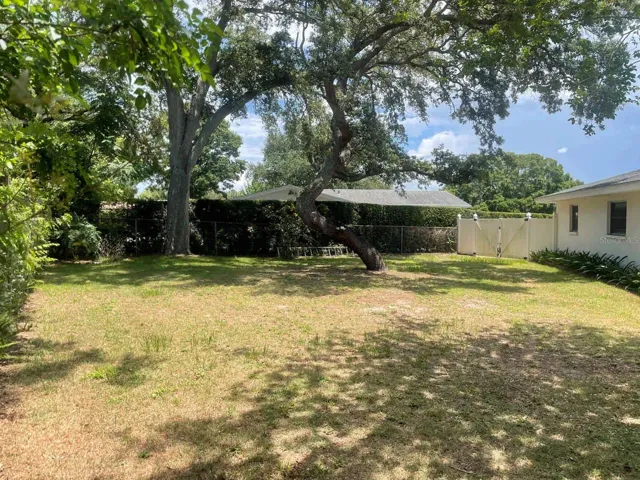 Side yard looking toward double gate