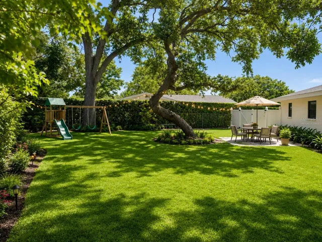 VIRTUALLY STAGED/DESIGNED view of side yard looking toward double gate.
