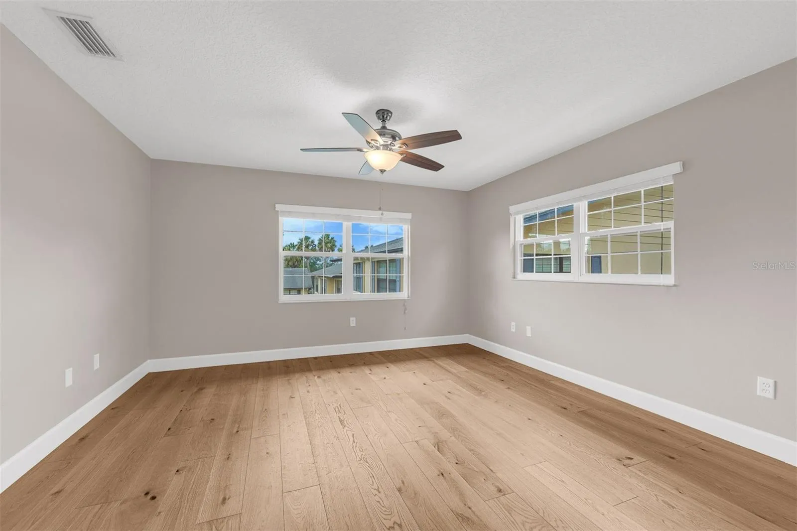 Primary Suite large enough to accommodate a king bed, with two walk in closets.