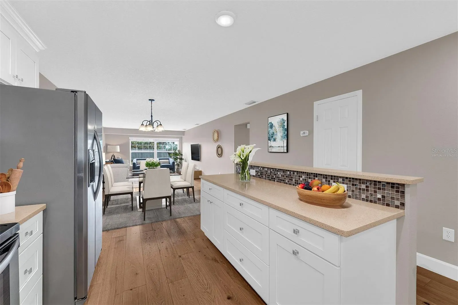 Updated Kitchen with Large Island. Open to Dining and Living Room.  Virtually Staged