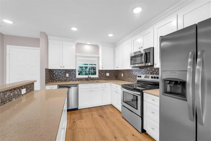 Window above kitchen sink allowing natural light to flow in