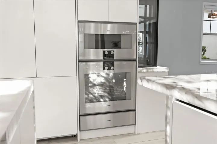 Gourmet kitchen complete with Gaggenau appliances and built-in nugget ice machine