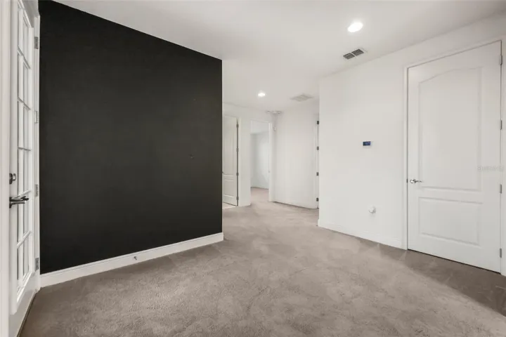 Landing at the top of the stairs with access to upstairs balcony.
