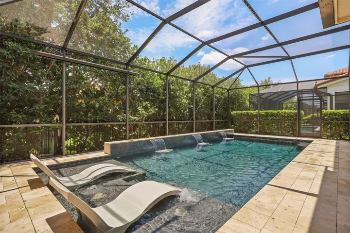 Backyard oasis complete with sun shelf, 3 water sheers, and beautiful saltwater pool