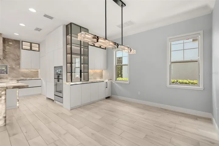 WOW! Luxurious backlit Brazilian Cristallo Quartzite countertops throughout the first floor!