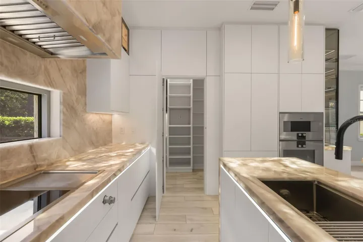 Gourmet kitchen complete with Gaggenau appliances and built-in nugget ice machine