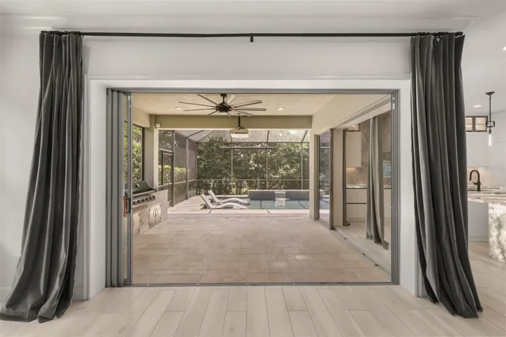 Living room sliding doors pocket completely to help bring the outside in