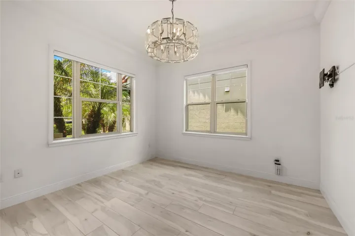 Flex room/Home office at front of home near foyer with Restoration Hardware chandalier