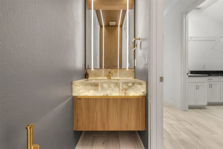 WOW! Luxurious backlit Brazilian Cristallo Quartzite countertops in the half bath downstairs