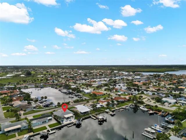 WATER VIEW FROM BOTH SIDES OF THE HOME.  FRONT OF HOME WATCH SUNRISE OVER CHANNEL WATER. BACK SIDE WATCH SUNSET OVER THE GULF WATER.  AMAZING LOCATION.  RARE FIND