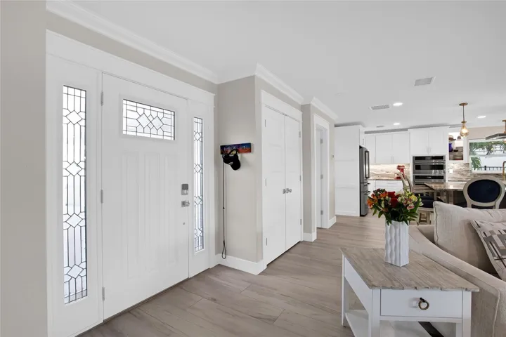 FRONT ENTRY.  PROCELAIN TILE THROUGHOUT THE WHOLE HOME - RING SYSTEM