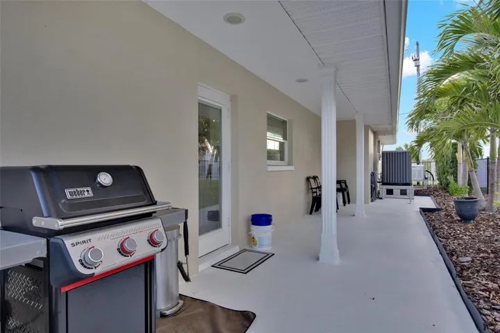GRILL SPACE + NEW HVAC WITH 10 Y WARRANTY.  DOOR LEADS TO KITCHEN - FULL FENCED YARD