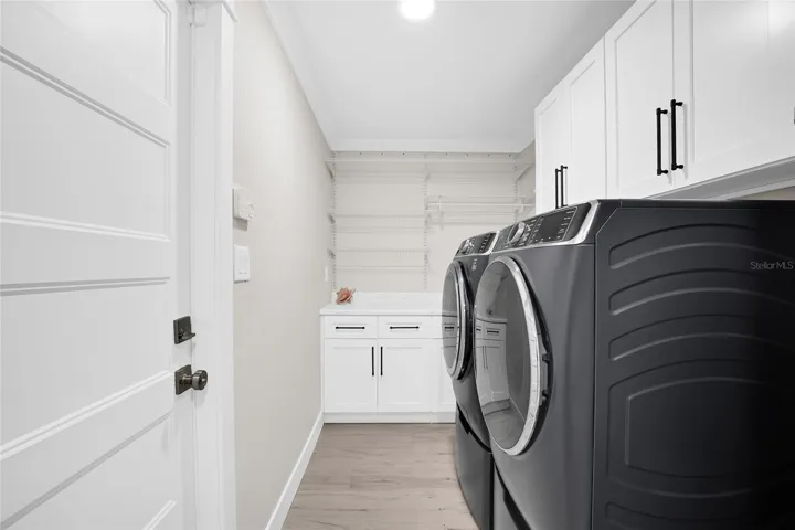 INSIDE LAUNDRY.  AMPLE STORAGE - WASHER AND DRYER ARE NEW AND CONVEY